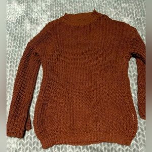 Rust colored sweater.